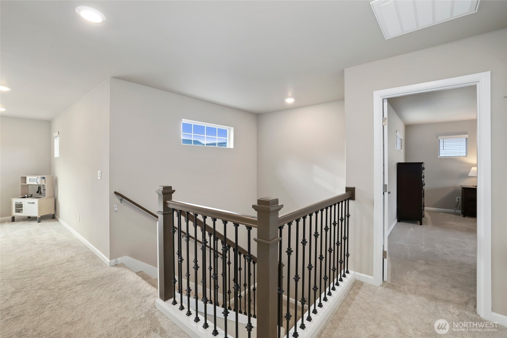 25704 207th Place Southeast Covington, WA 98042 - Photo 12 of 34 a view of a hallway with a bedroom and windows