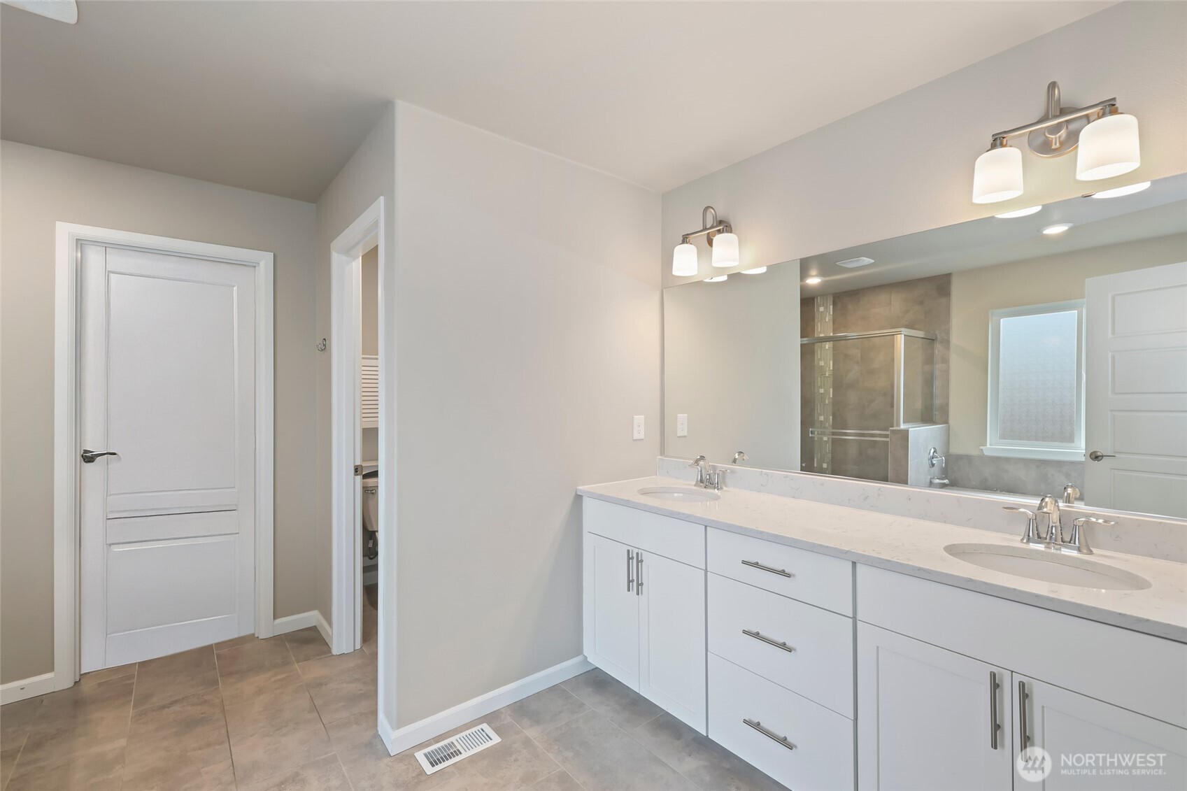 25704 207th Place Southeast Covington, WA 98042 - Photo 17 of 34 a bathroom with a granite countertop sink mirror and a