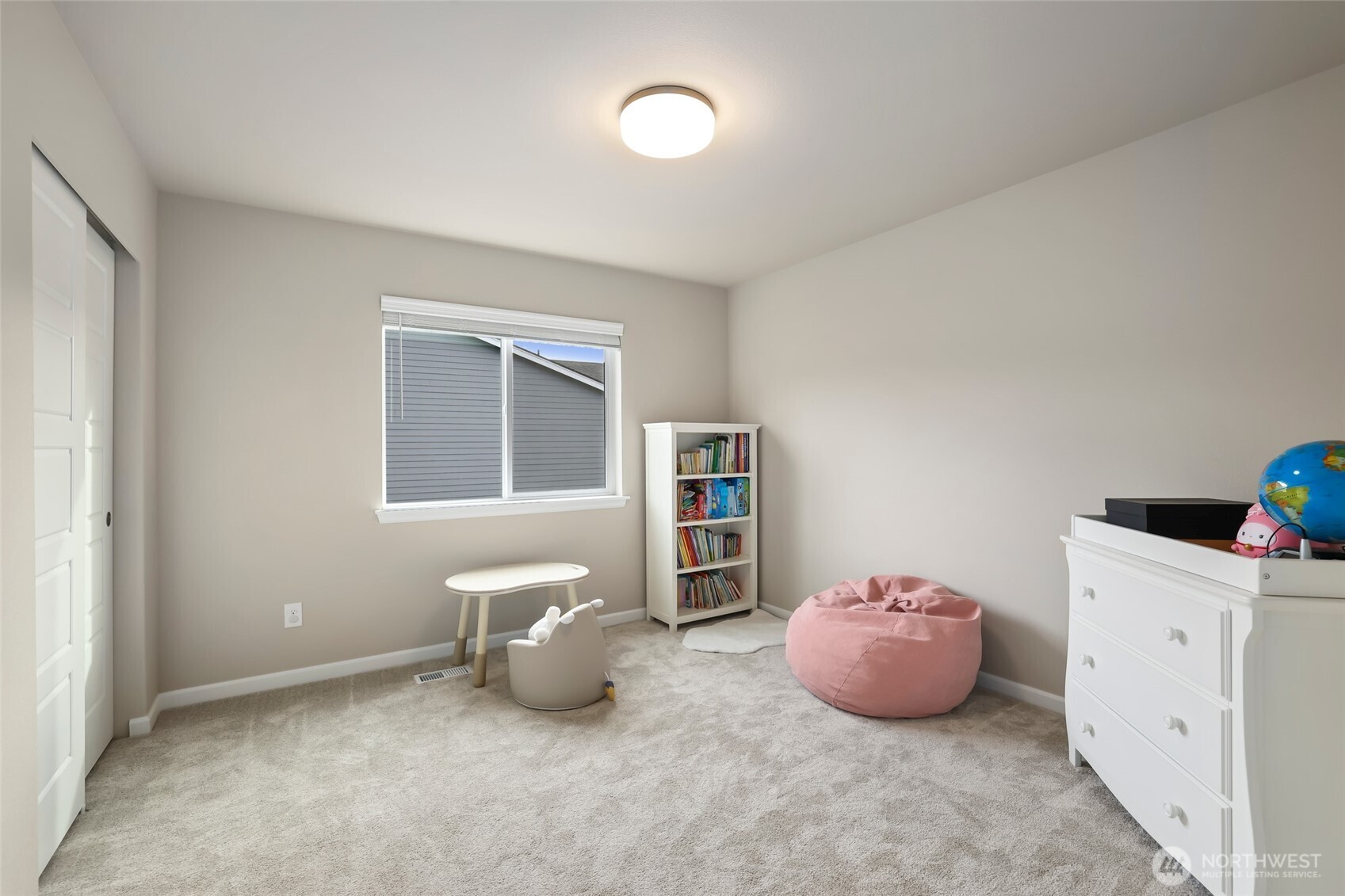 25704 207th Place Southeast Covington, WA 98042 - Photo 21 of 34 a spacious bedroom with a bed and a window