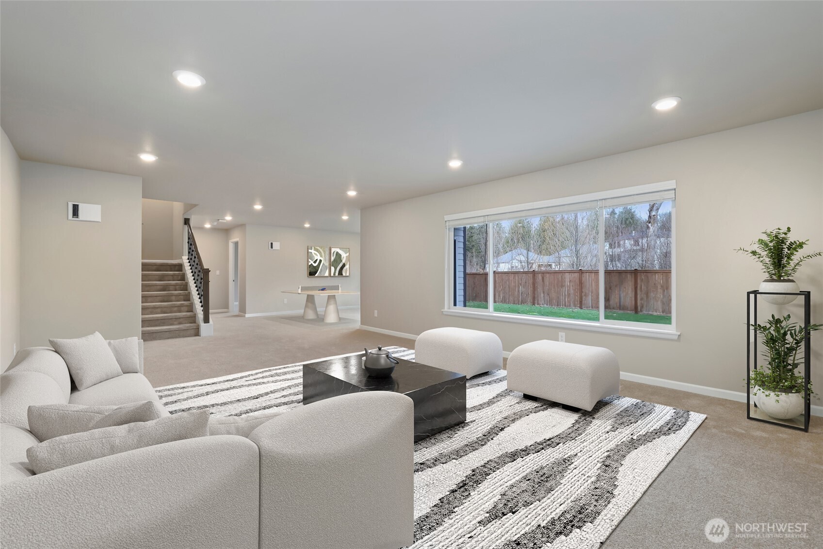 25704 207th Place Southeast Covington, WA 98042 - Photo 24 of 34 a living room with furniture and a large window