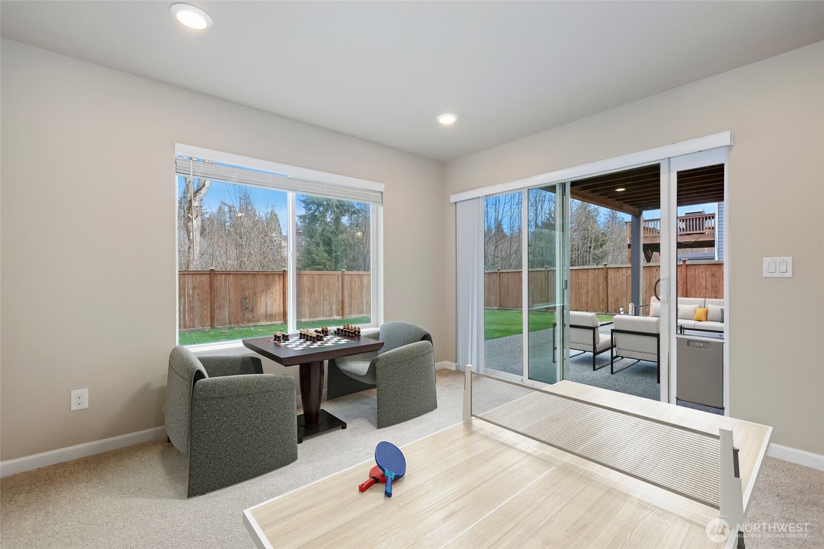 25704 207th Place Southeast Covington, WA 98042 - Photo 27 of 34 a living room with furniture and large windows