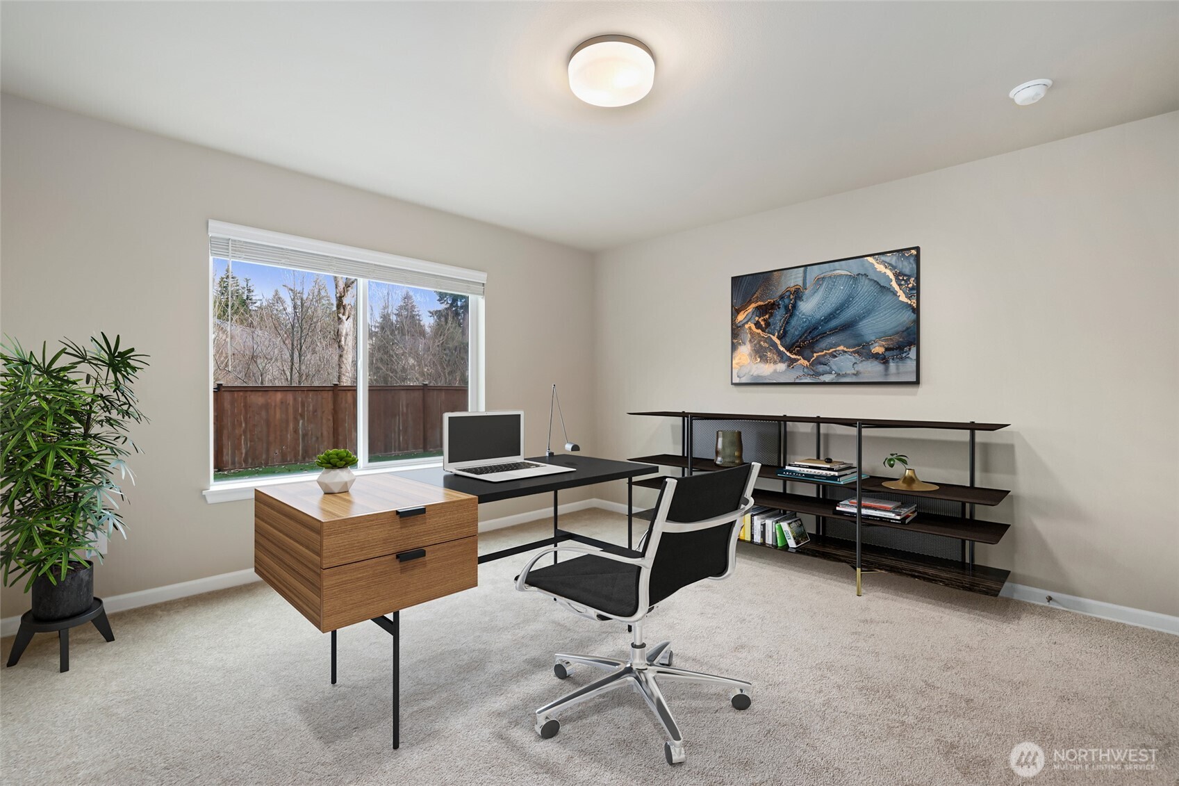 25704 207th Place Southeast Covington, WA 98042 - Photo 28 of 34 a view of a workspace with furniture and a potted plant