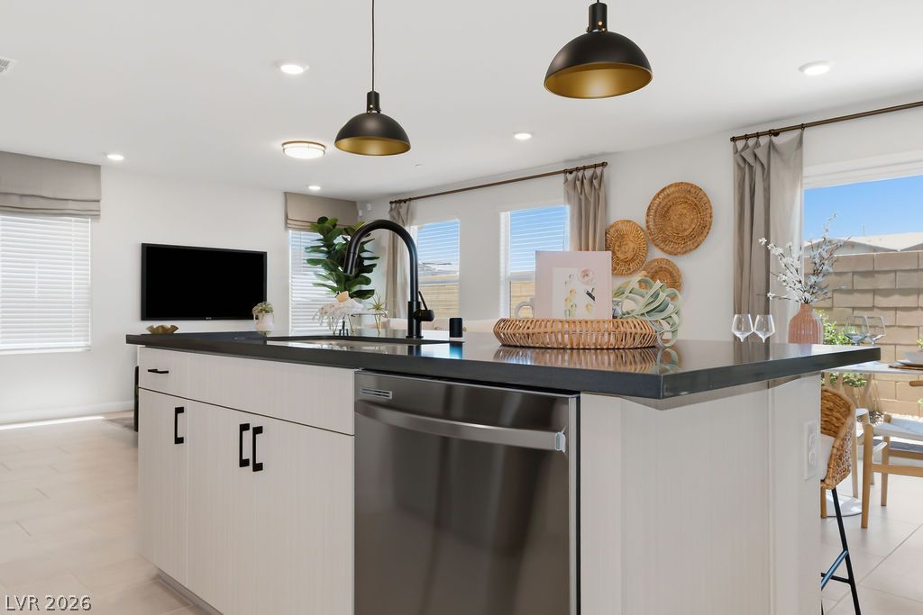 913 Cadence View Way Henderson, NV 89011 - Photo 20 of 46 An inviting kitchen island provides an ideal space for culinary creations and casual dining.