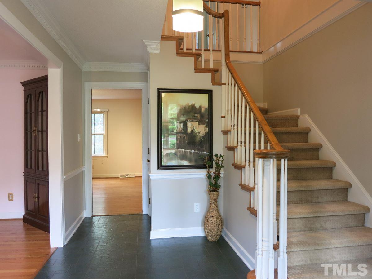 1120 Country Ridge Drive Raleigh, NC 27609 - Photo 3 of 25 Gracious Foyer w/slate-look floor, dentil crown molding & coat closet.