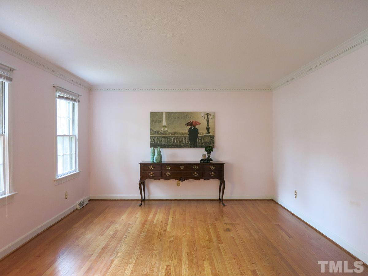 1120 Country Ridge Drive Raleigh, NC 27609 - Photo 4 of 25 Off the Foyer, the spacious Living Rm has hardwood floors & dentil crown molding.