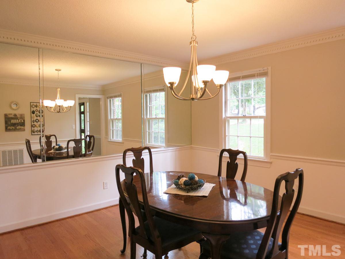 1120 Country Ridge Drive Raleigh, NC 27609 - Photo 5 of 25 Also off the Foyer is the spacious Dining Rm w/ hardwood floors and dentil crown & chair rail molding.