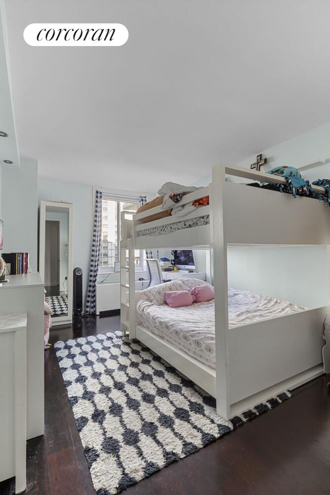 333 Rector Place, Unit 1009 Manhattan, NY 10280 - Photo 7 of 11 a bedroom with a bed and window