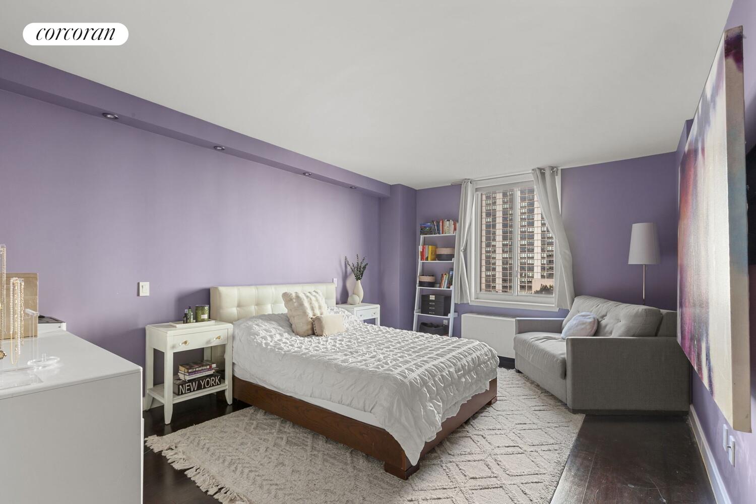 333 Rector Place, Unit 1009 Manhattan, NY 10280 - Photo 8 of 11 a bedroom with a bed and a couch