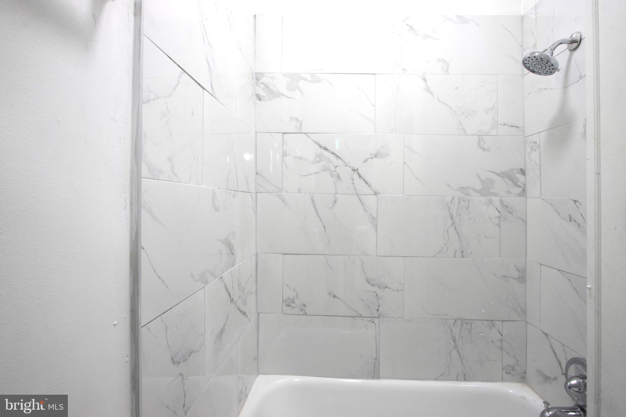 3438 Belair Road Baltimore, MD 21213 - Photo 21 of 36 a bathroom with a bathtub