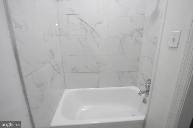 a bathroom with a bathtub