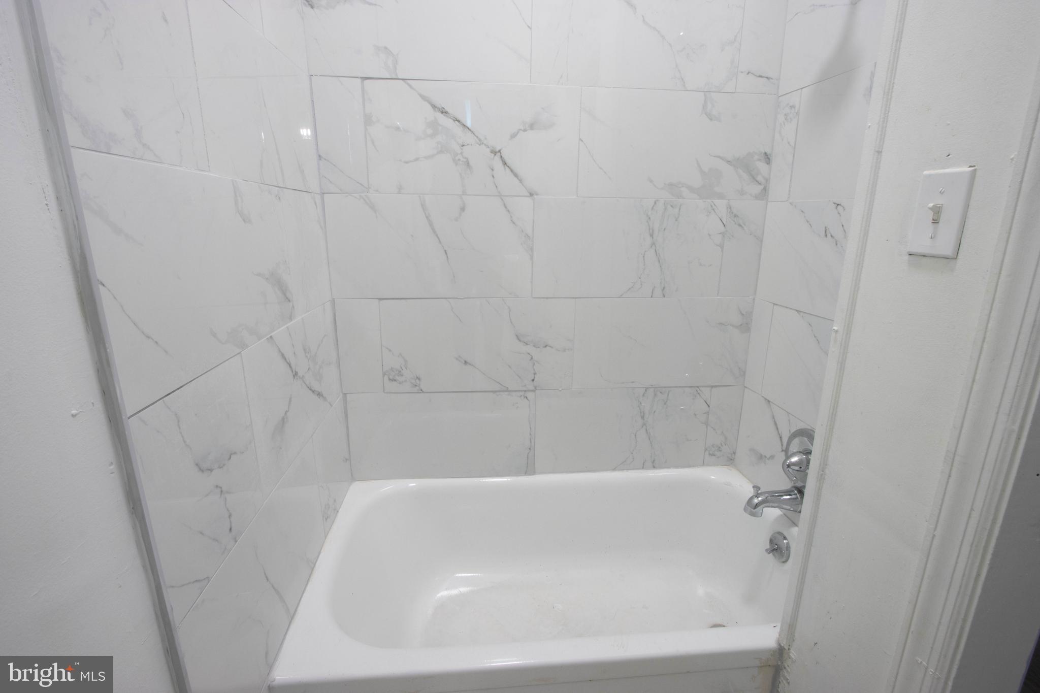 3438 Belair Road Baltimore, MD 21213 - Photo 22 of 36 a bathroom with a bathtub