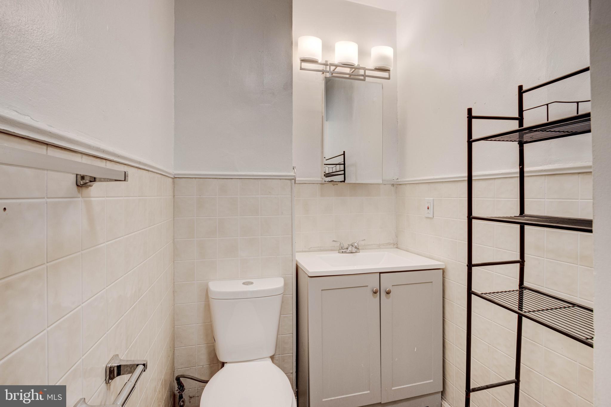 3438 Belair Road Baltimore, MD 21213 - Photo 24 of 36 a bathroom with a toilet sink and shower