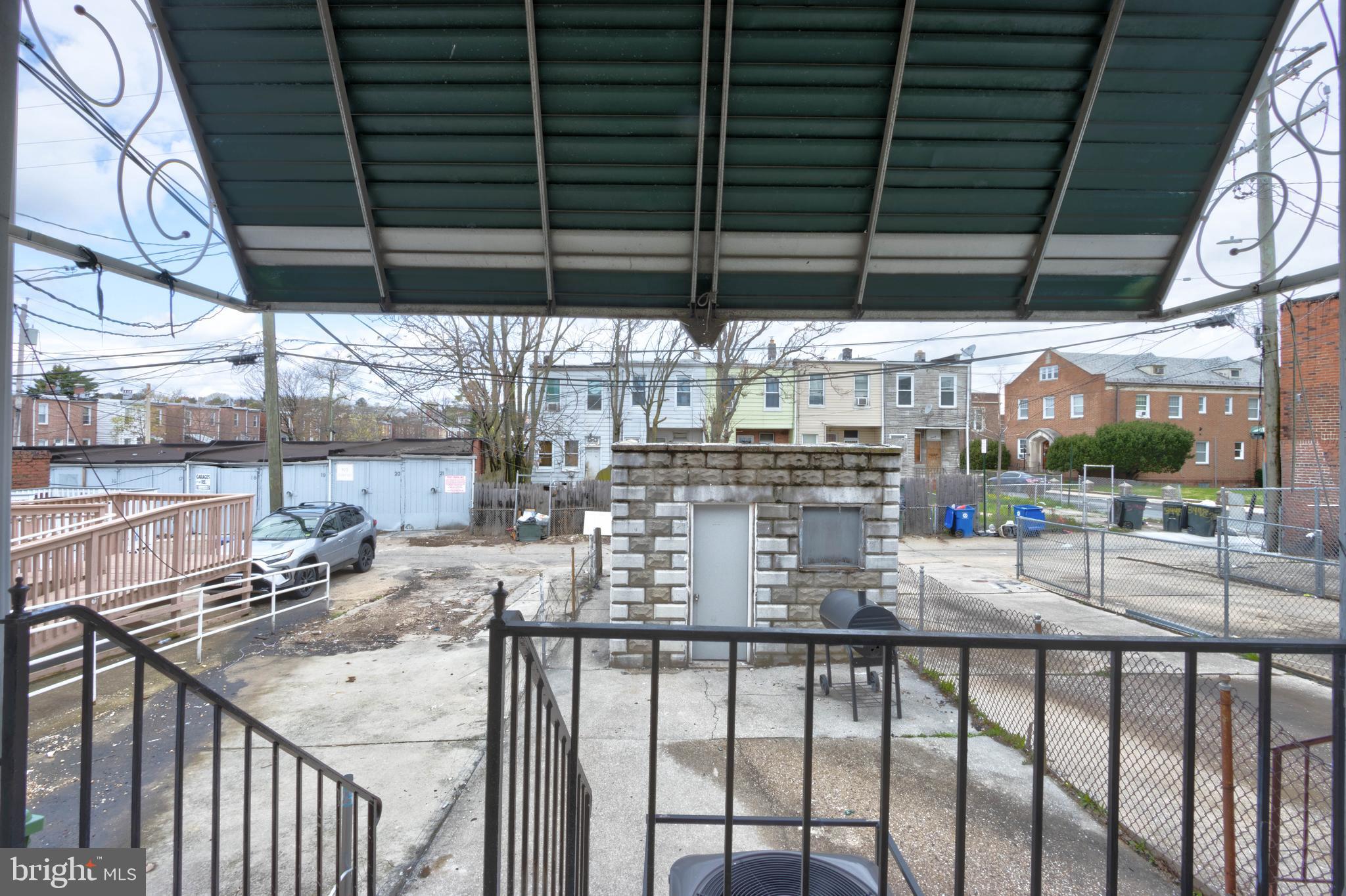 3438 Belair Road Baltimore, MD 21213 - Photo 31 of 36 a view of a chairs and table in the balcony