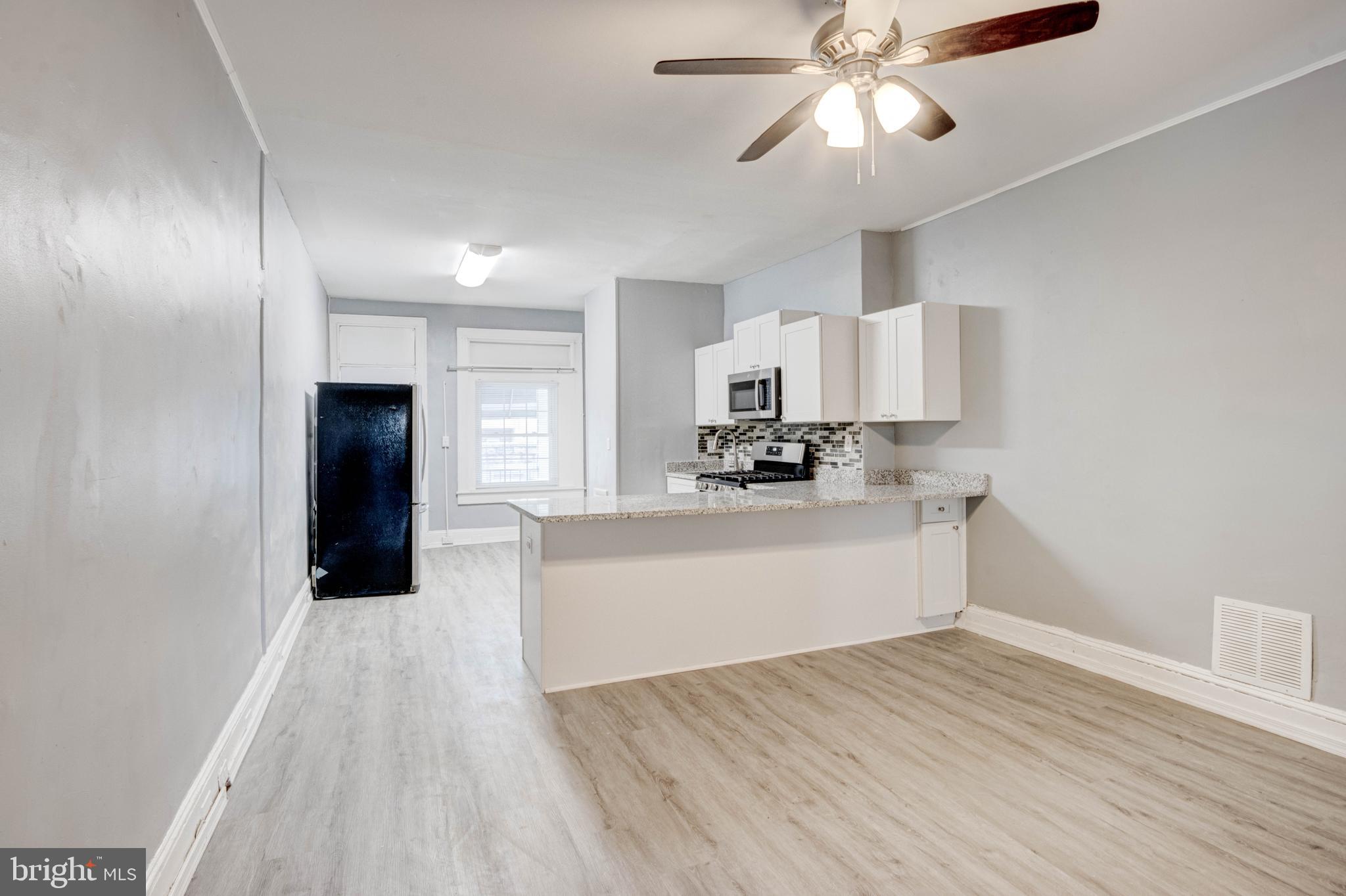 3438 Belair Road Baltimore, MD 21213 - Photo 5 of 36 a view of a kitchen with electric appliances