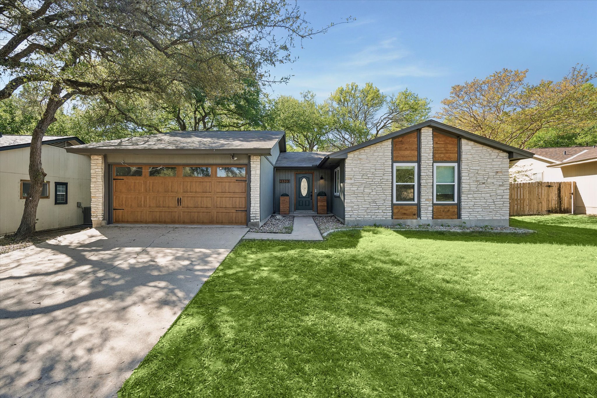 3103 Canter Lane Austin, TX 78759 - Photo 1 of 1 a front view of a house with a yard and garage