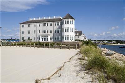 23 Snow Inn Road, Unit 3 Harwich Port, MA 02646 - Photo 1 of 6 a view of a lake with building in front of it