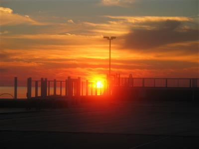 23 Snow Inn Road, Unit 3 Harwich Port, MA 02646 - Photo 5 of 6 a sunset view with a lake