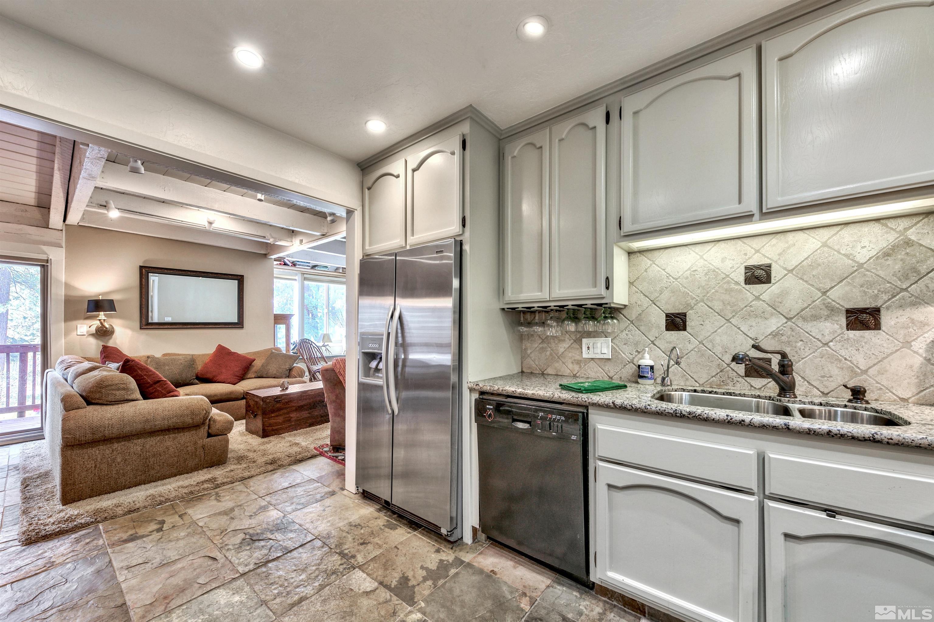 26 Cascade Court Stateline, NV 89449 - Photo 13 of 30 a living room with granite countertop furniture and a refrigerator