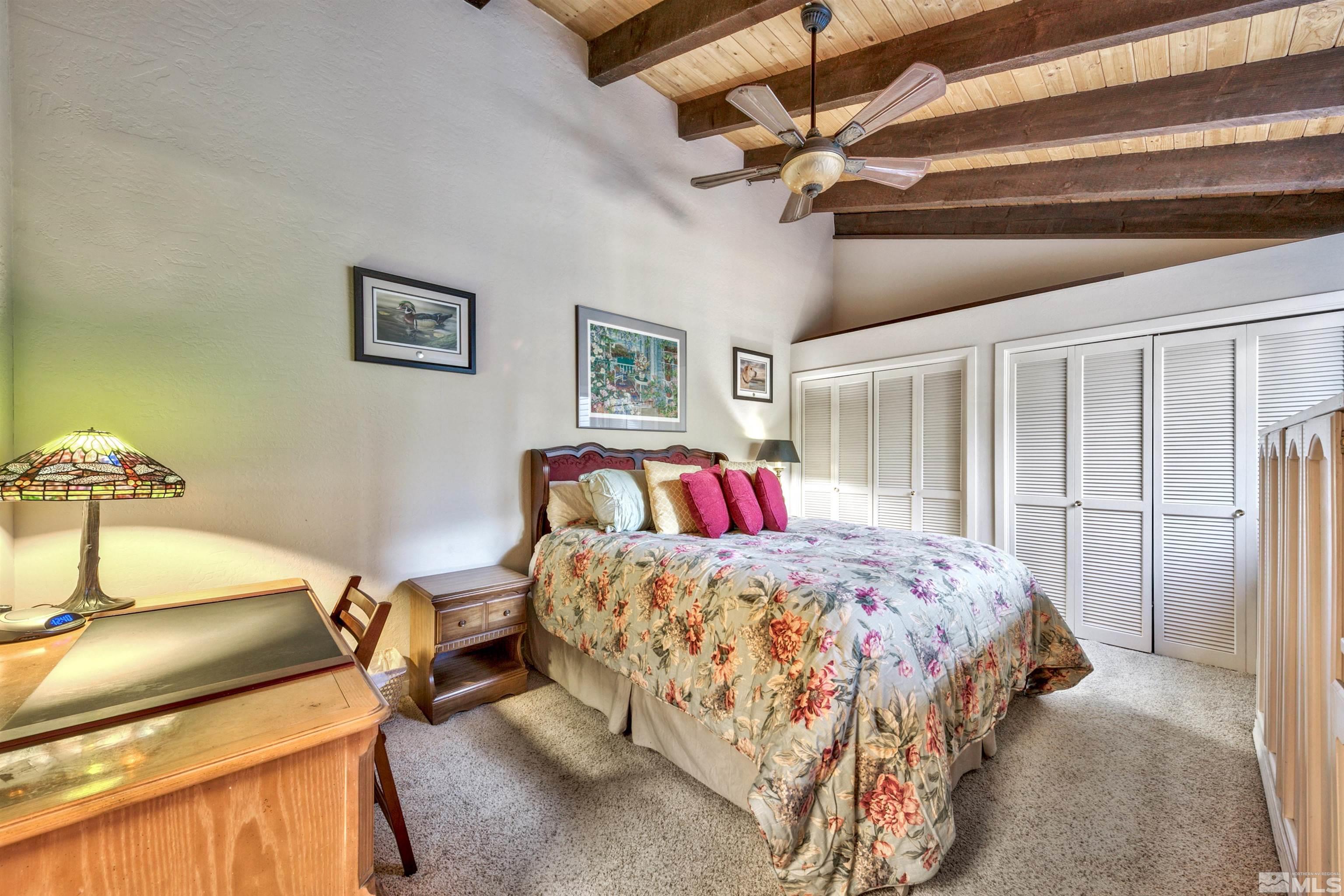 26 Cascade Court Stateline, NV 89449 - Photo 20 of 30 a bedroom with a bed and a dresser