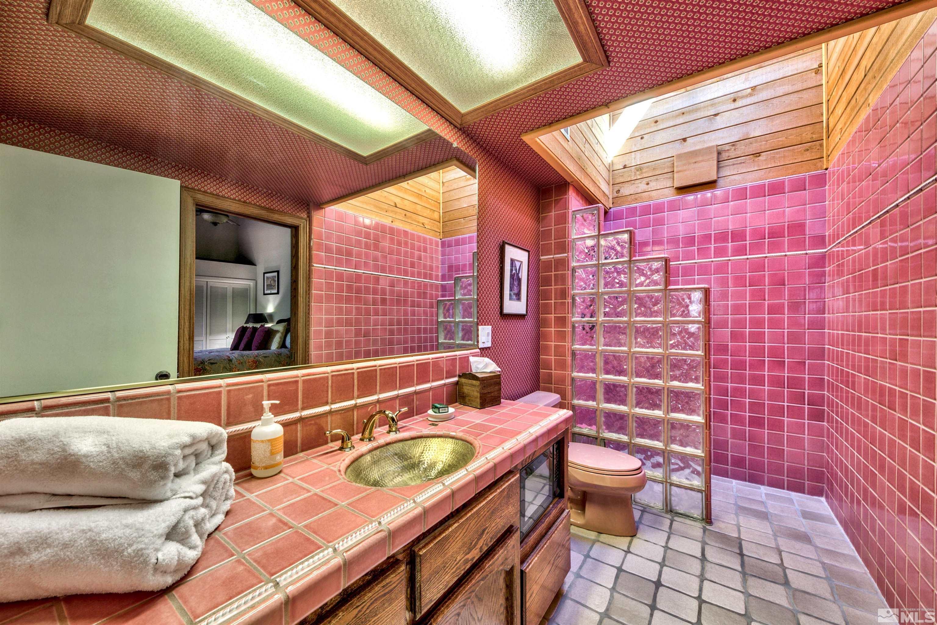 26 Cascade Court Stateline, NV 89449 - Photo 21 of 30 a bathroom with a sink and mirror