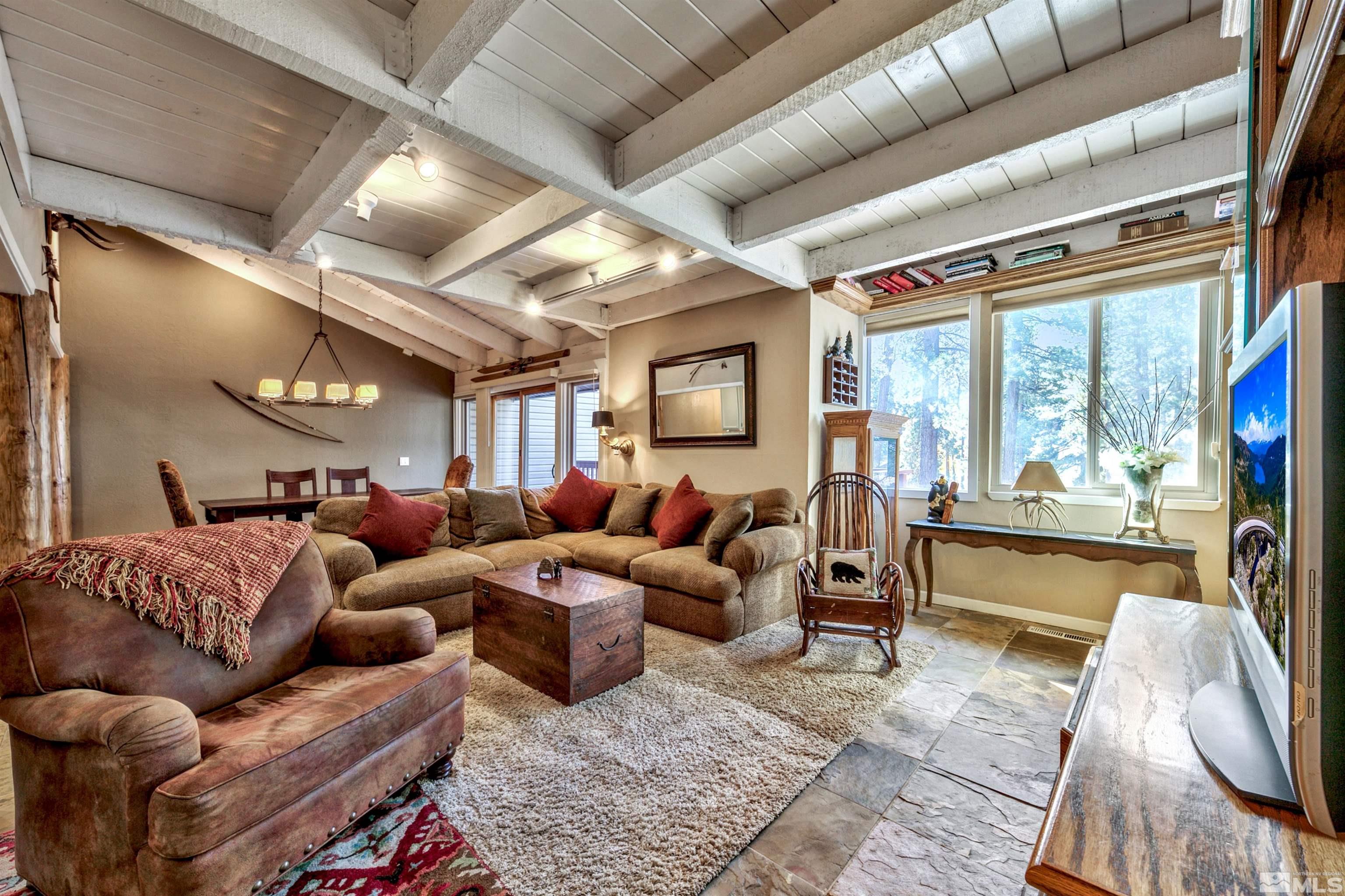 26 Cascade Court Stateline, NV 89449 - Photo 4 of 30 a living room with furniture ceiling fan and a rug