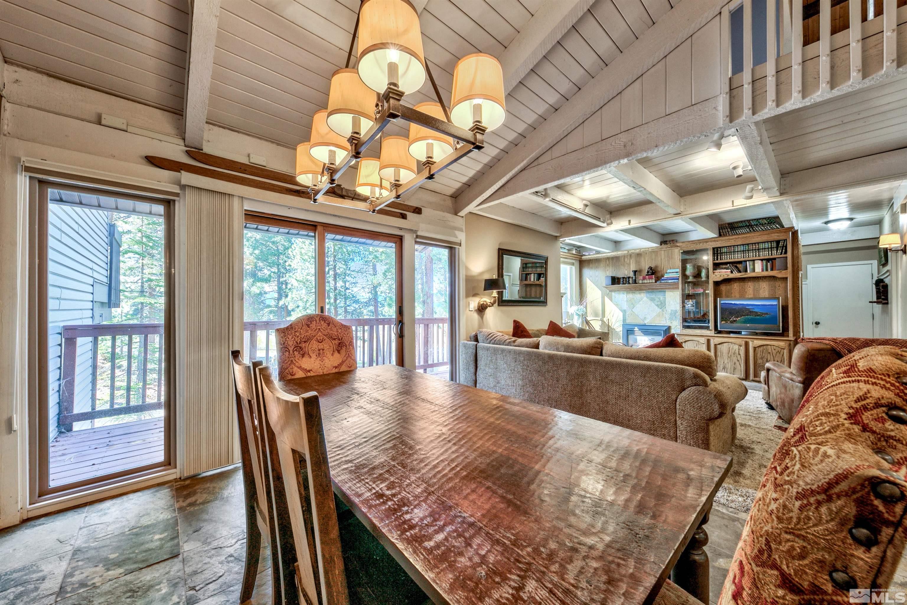 26 Cascade Court Stateline, NV 89449 - Photo 10 of 30 a view of a dining room with furniture wooden floor and chandelier