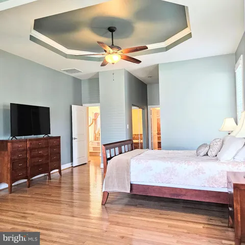 a bathroom with a granite countertop bathtub and shower