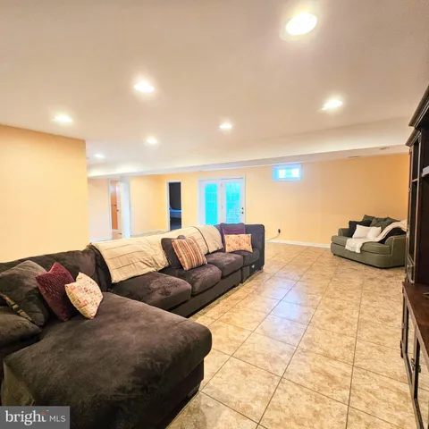 a view of a house with backyard porch and sitting area