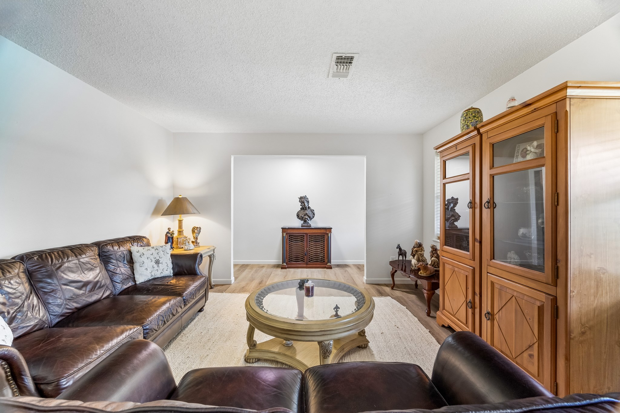 413 Mebane Lane Rosenberg, TX 77471 - Photo 11 of 30 Upon entering the home, you will be greeted by a cozy formal living room that has recently been painted. It is the perfect for relaxation and entertaining.
