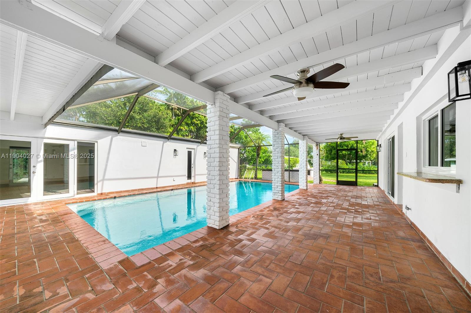 7575 Southwest 134th Street Pinecrest, FL 33156 - Photo 14 of 28 a view of a house with a swimming pool
