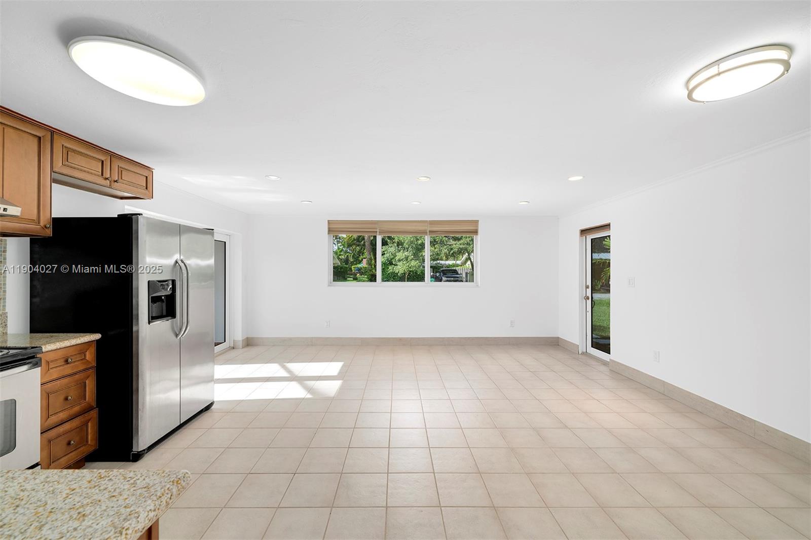 7575 Southwest 134th Street Pinecrest, FL 33156 - Photo 15 of 28 a view of a kitchen with microwave and refrigerator