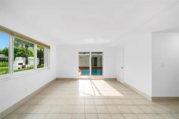 a bathroom with a mirror and shower