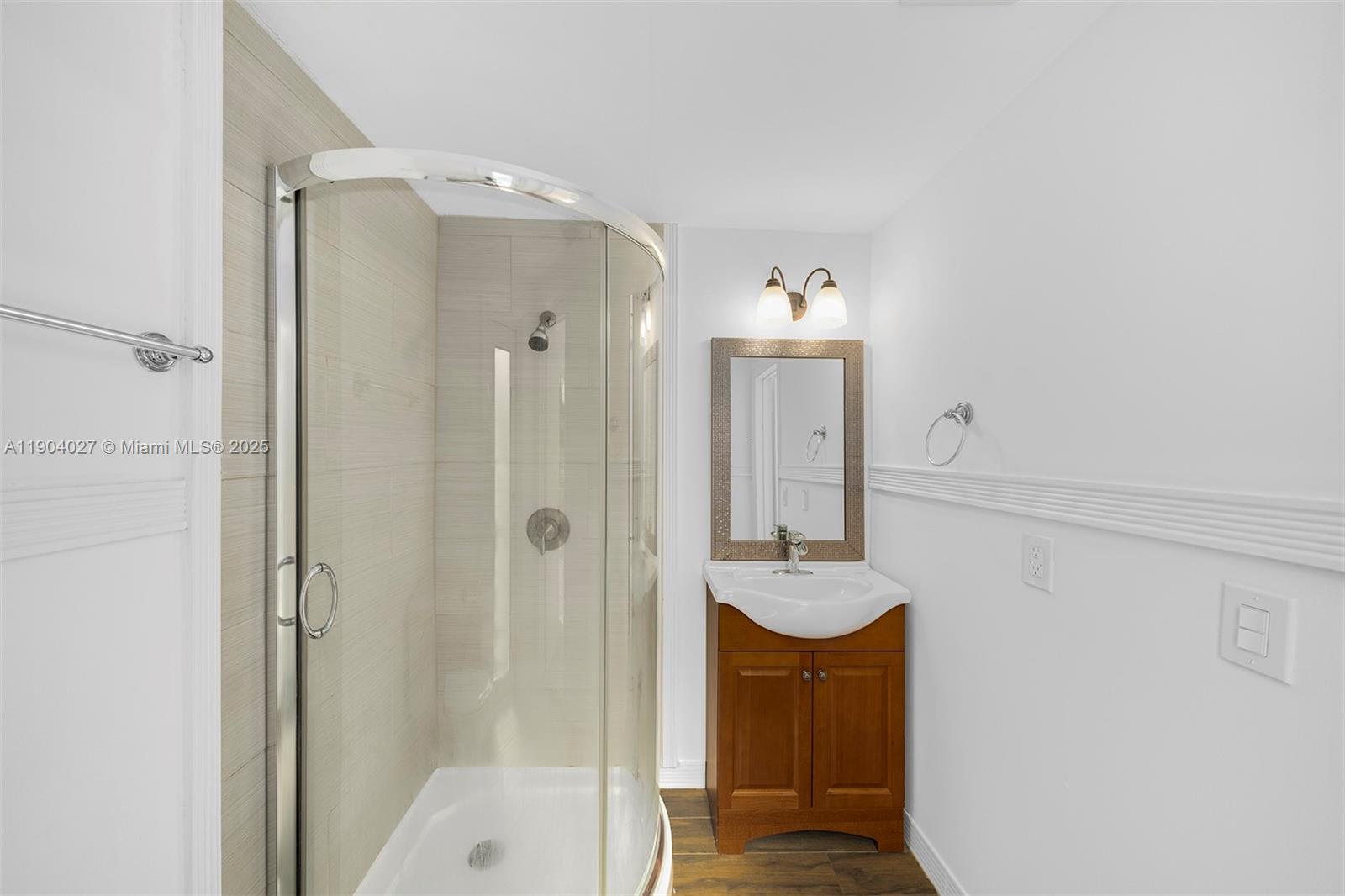 7575 Southwest 134th Street Pinecrest, FL 33156 - Photo 18 of 28 a bathroom with a mirror and shower