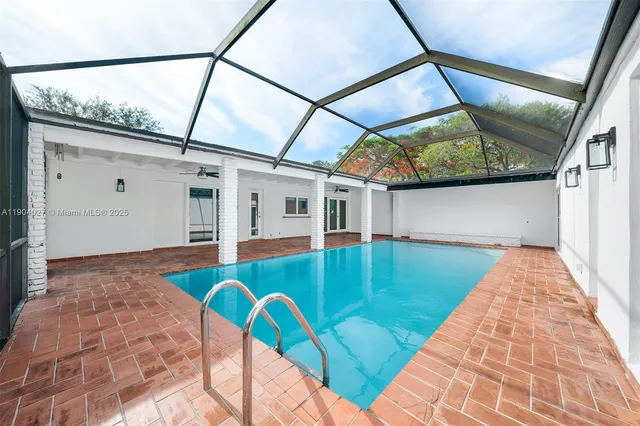 a view of swimming pool with a yard