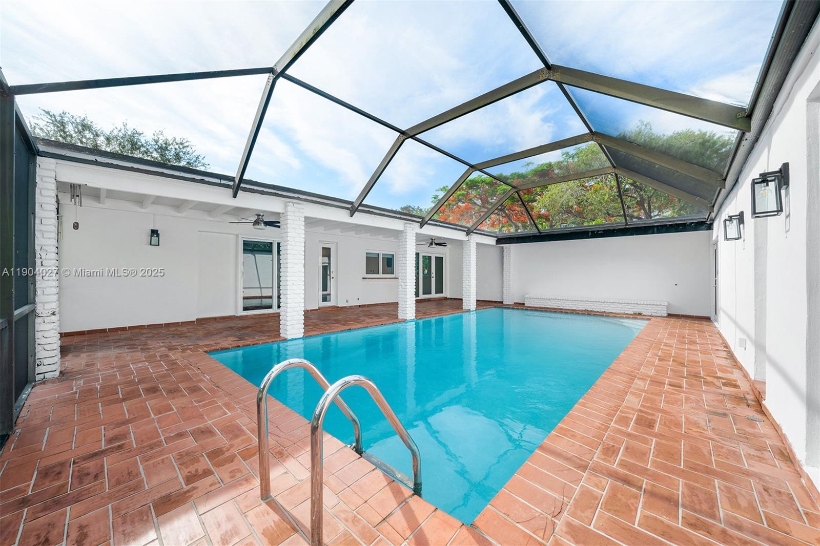 7575 Southwest 134th Street Pinecrest, FL 33156 - Photo 22 of 28 a view of swimming pool with seating area