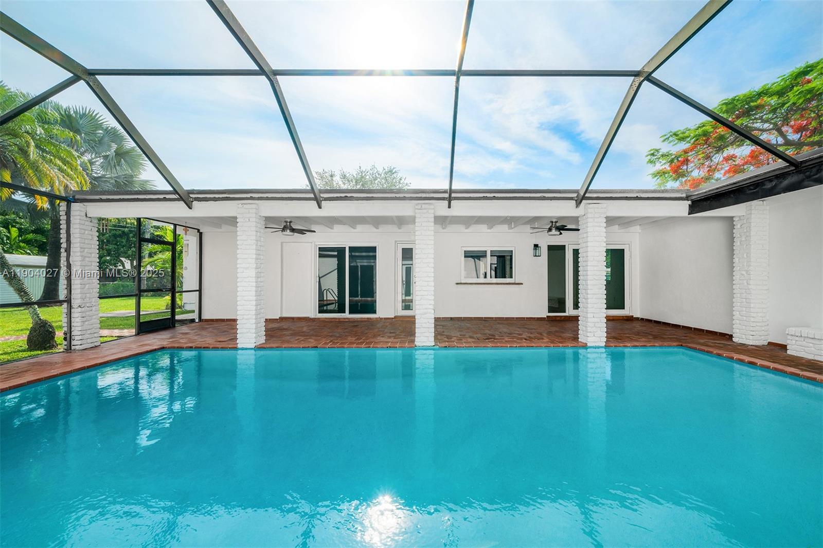 7575 Southwest 134th Street Pinecrest, FL 33156 - Photo 23 of 28 a view of swimming pool with a yard