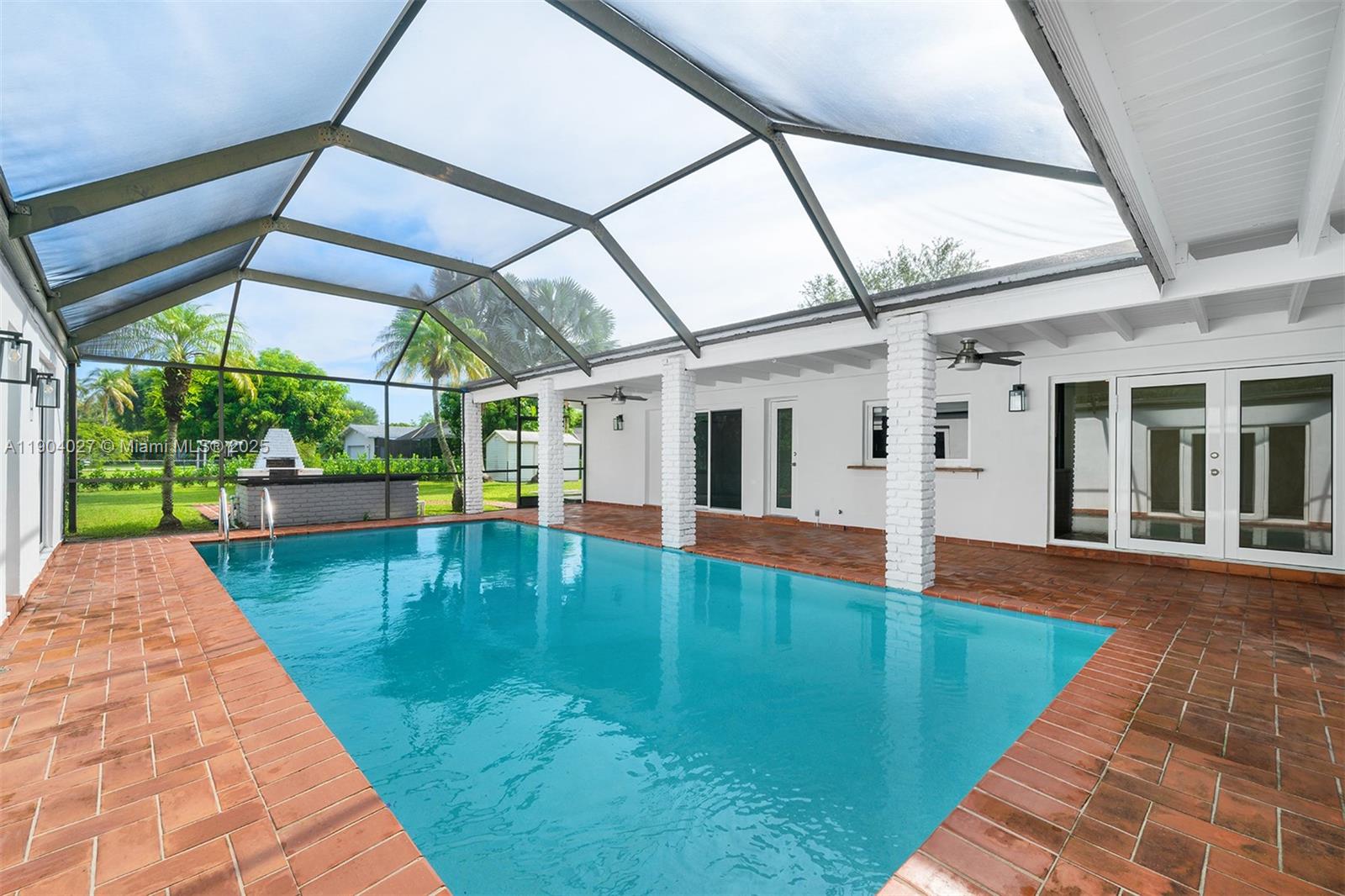 7575 Southwest 134th Street Pinecrest, FL 33156 - Photo 24 of 28 a view of swimming pool with a yard