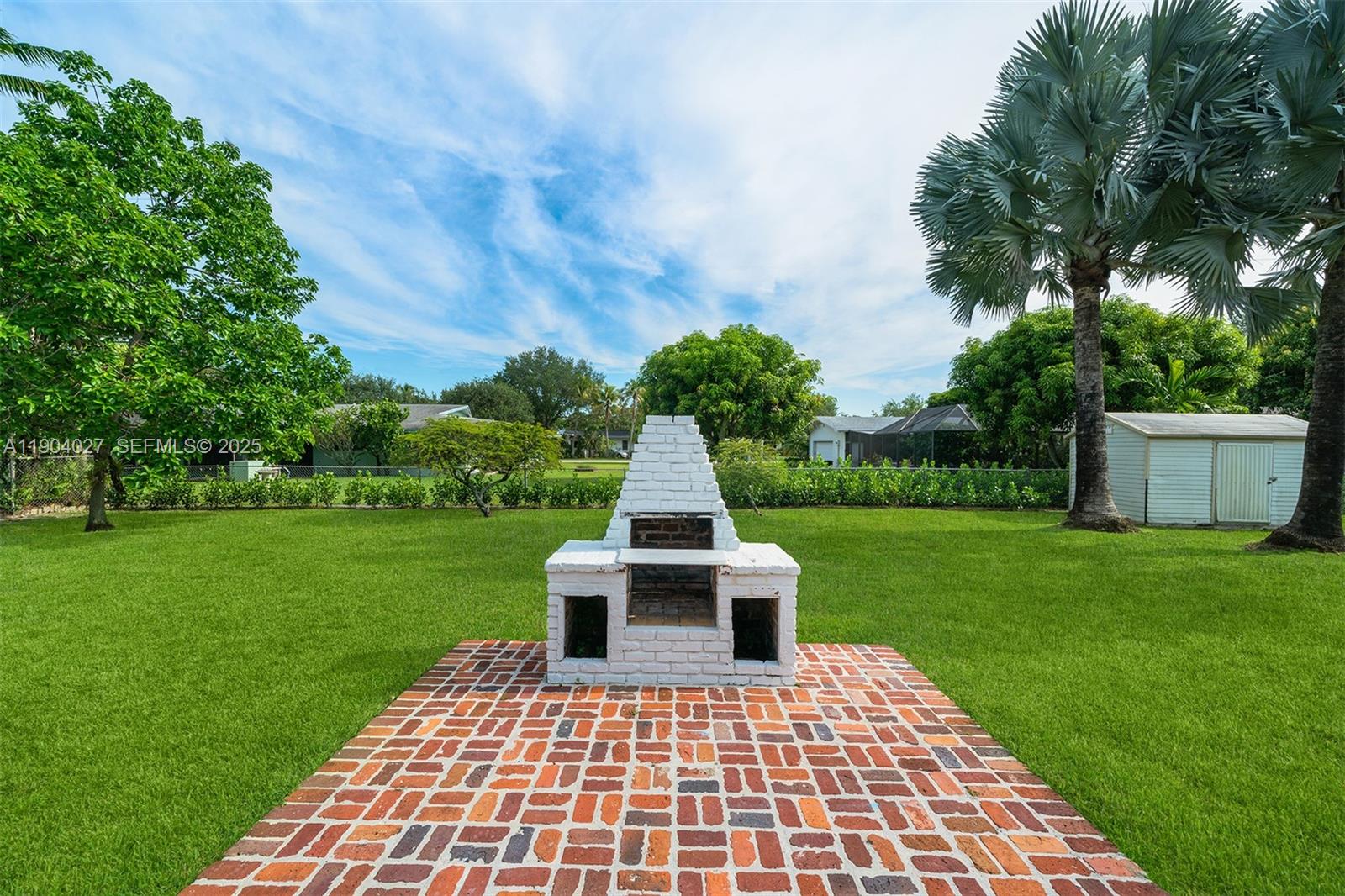7575 Southwest 134th Street Pinecrest, FL 33156 - Photo 25 of 28 a view of a deck with a garden