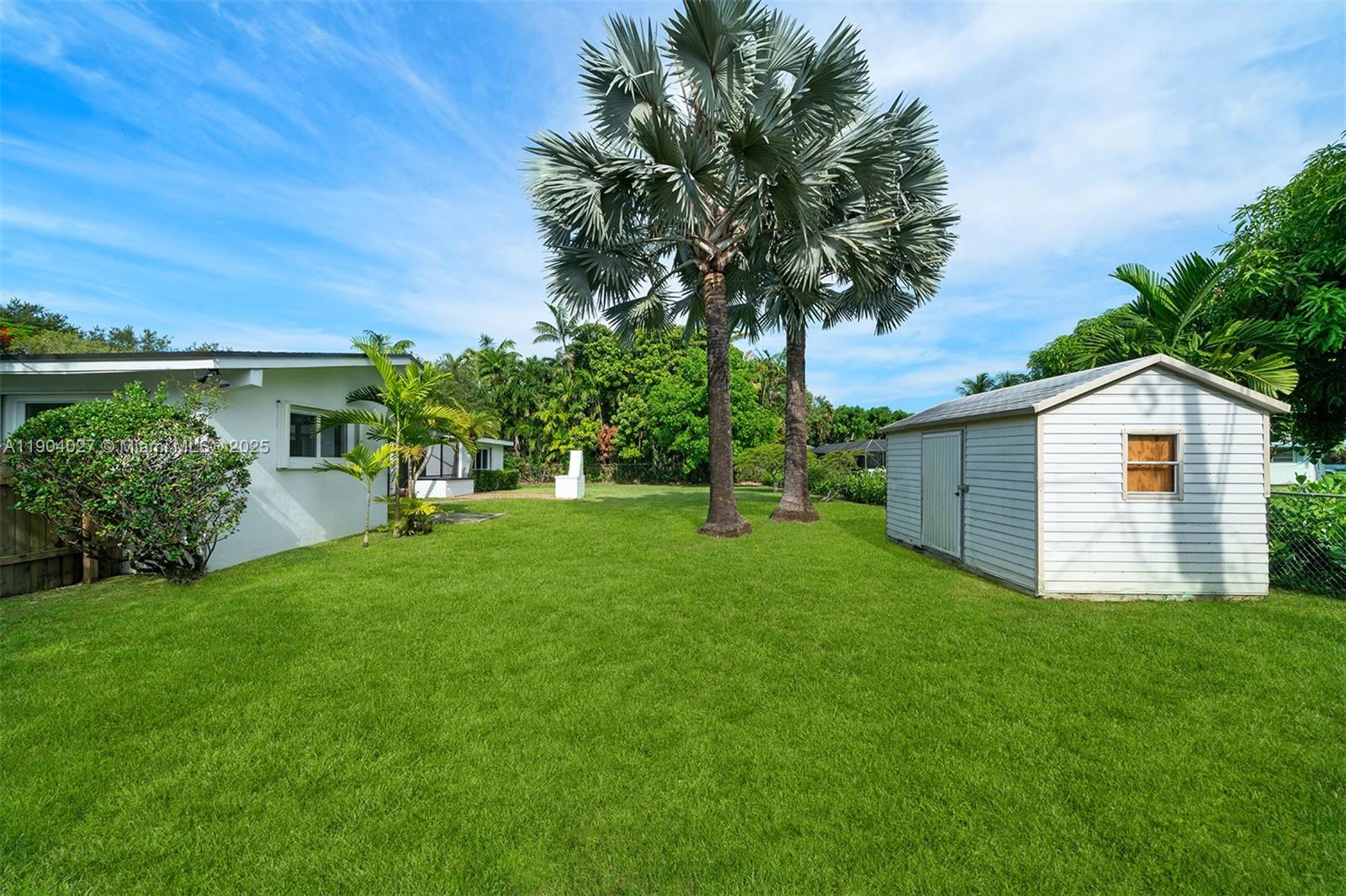 7575 Southwest 134th Street Pinecrest, FL 33156 - Photo 28 of 28 a view of a house with a yard