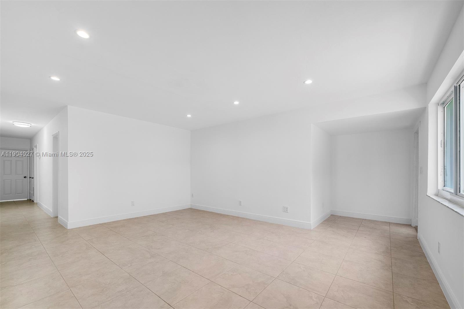 7575 Southwest 134th Street Pinecrest, FL 33156 - Photo 9 of 28 an empty room with windows