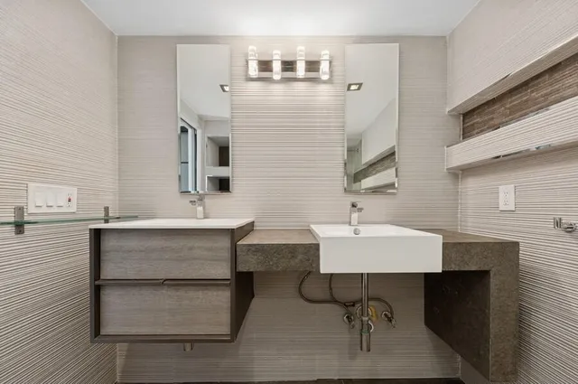 a bathroom with a toilet and shower