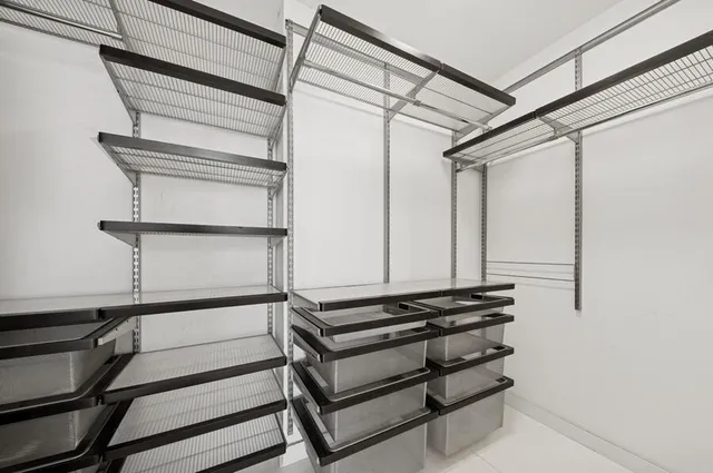a bathroom with a double vanity sink mirror and shower