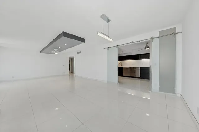 a view of a room with a closet and electronic appliances