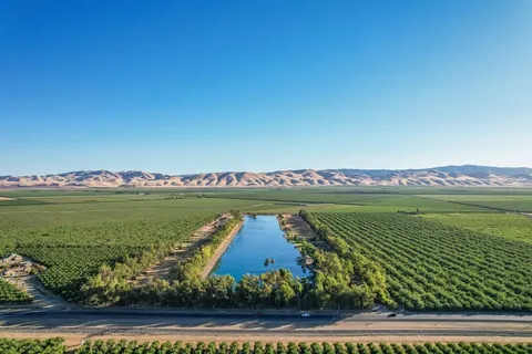 a view of lake with green space