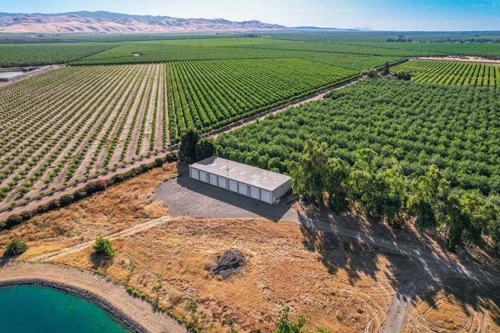 10037 Highway 33 Patterson, CA 95363 - Photo 12 of 19 a view of a wooden deck with a garden