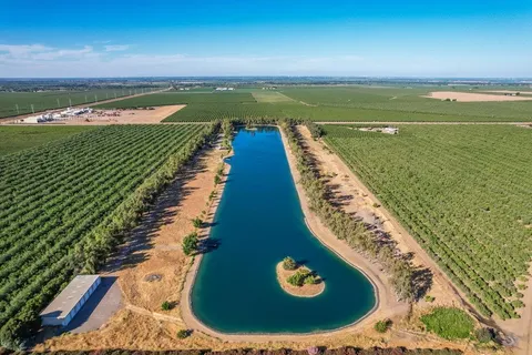 a view of a swimming pool with a outdoor seating