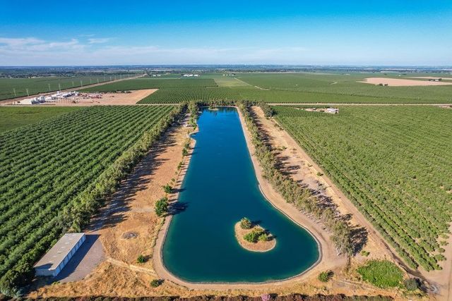 a view of a swimming pool with a outdoor seating