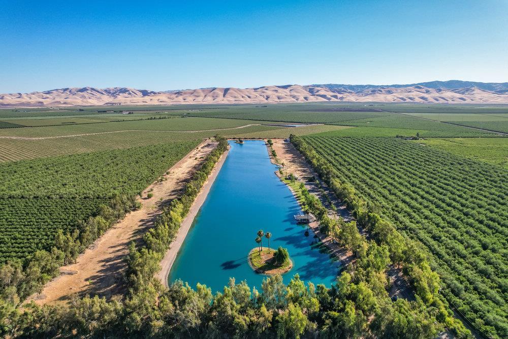 10037 Highway 33 Patterson, CA 95363 - Photo 17 of 19 a view of a lake with a mountain in the background