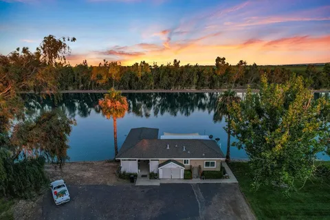 a view of a lake with sitting area