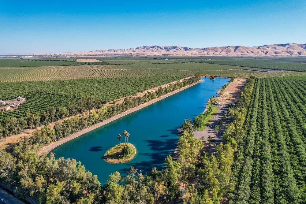 10037 Highway 33 Patterson, CA 95363 - Photo 10 of 19 a view of a lake with a mountain in the background